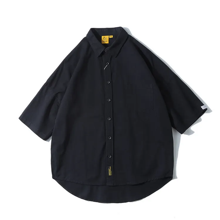 Man wearing a loose-fit Japanese style cotton cardigan shirt in a summer colour.