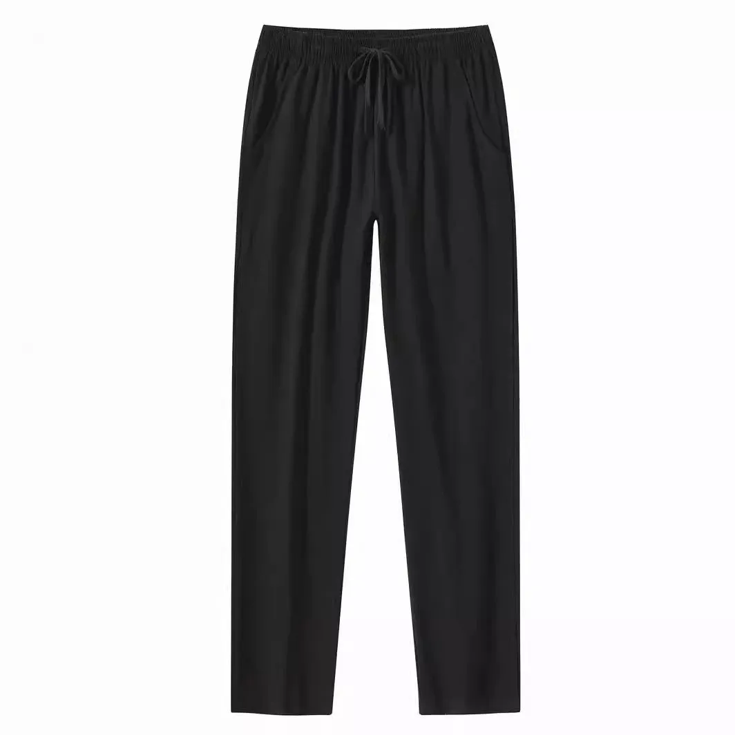 Men's loose-fitting cotton beach pants in khaki colour on a casual background.
