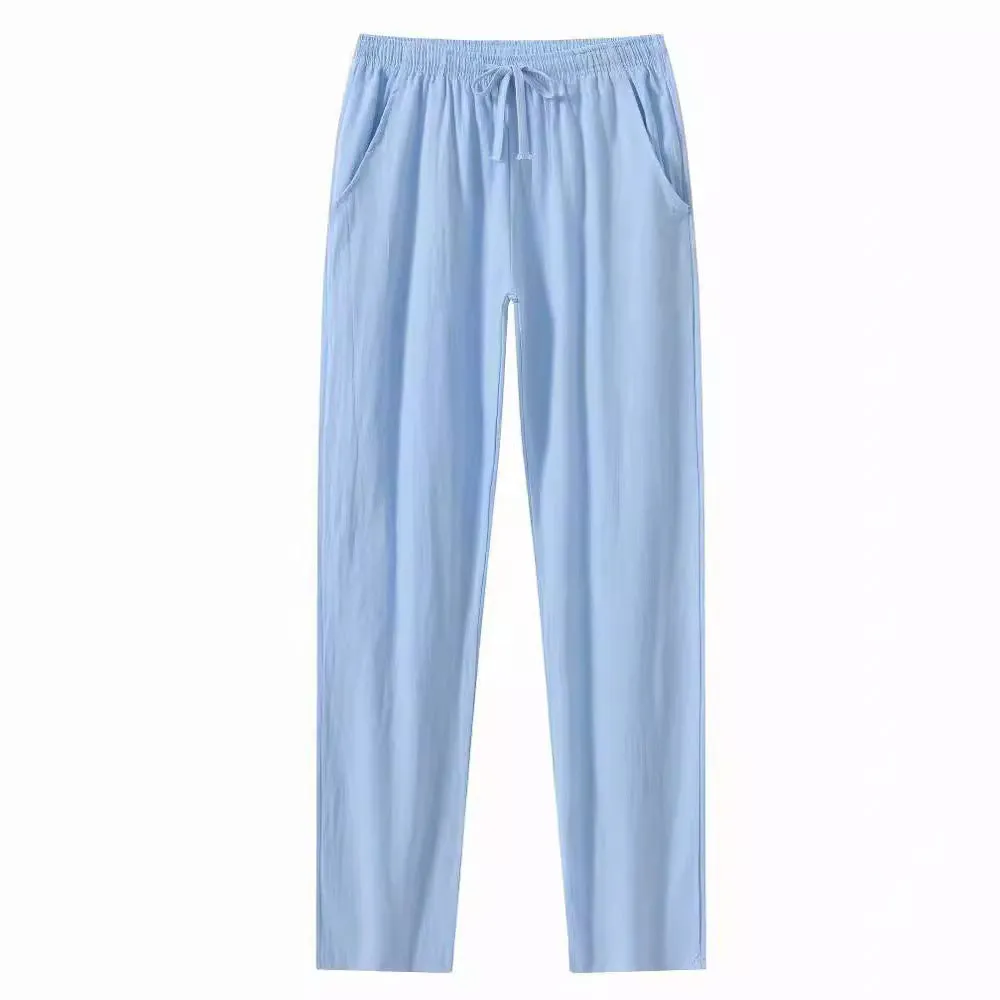 Men's loose-fitting cotton beach pants in khaki colour on a casual background.