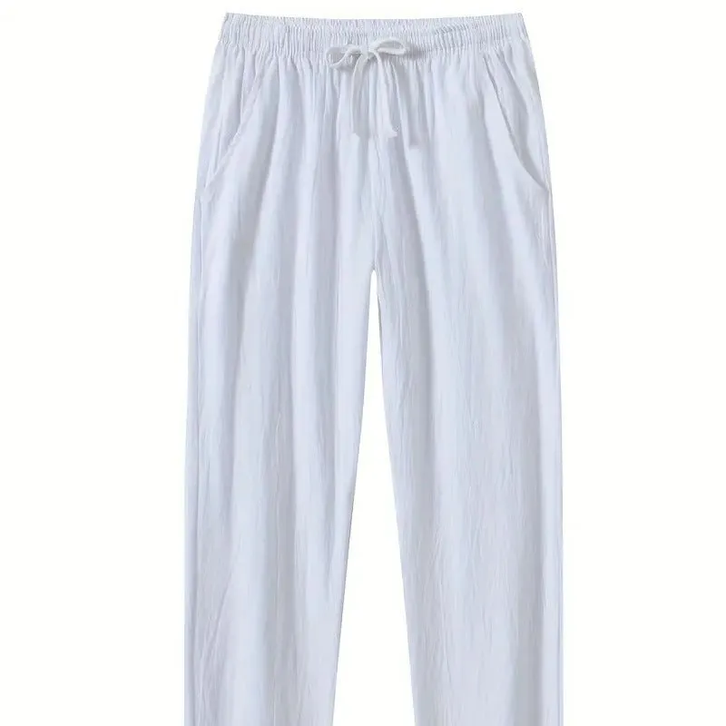 Men's loose-fitting cotton beach pants in khaki colour on a casual background.