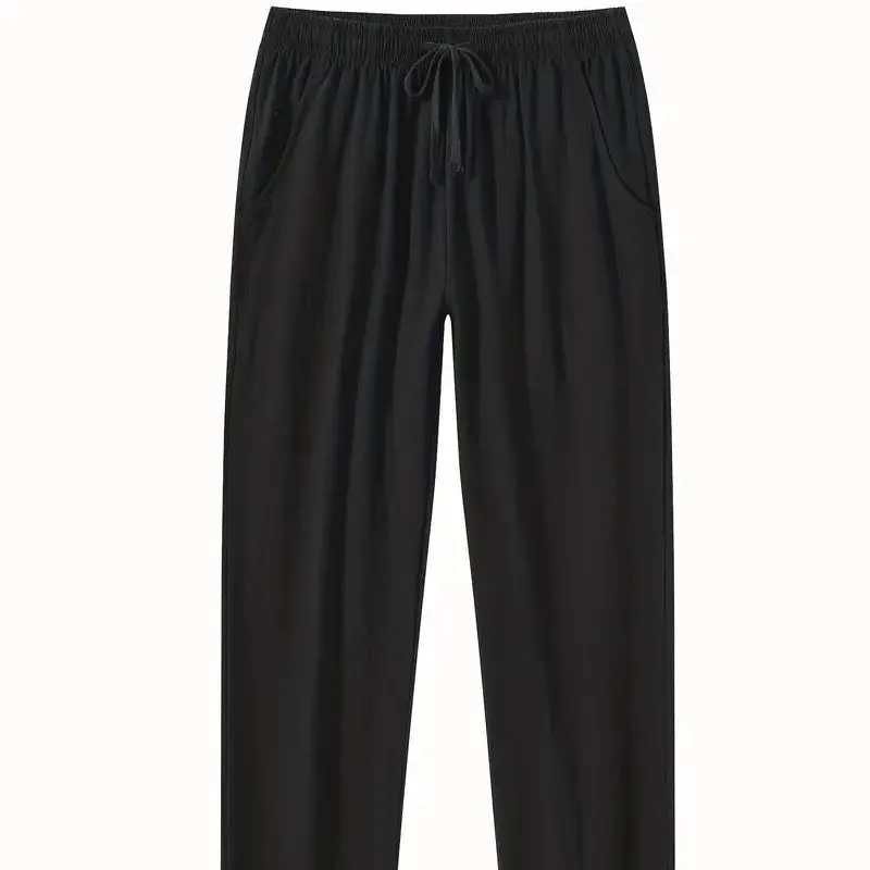Men's loose-fitting cotton beach pants in khaki colour on a casual background.
