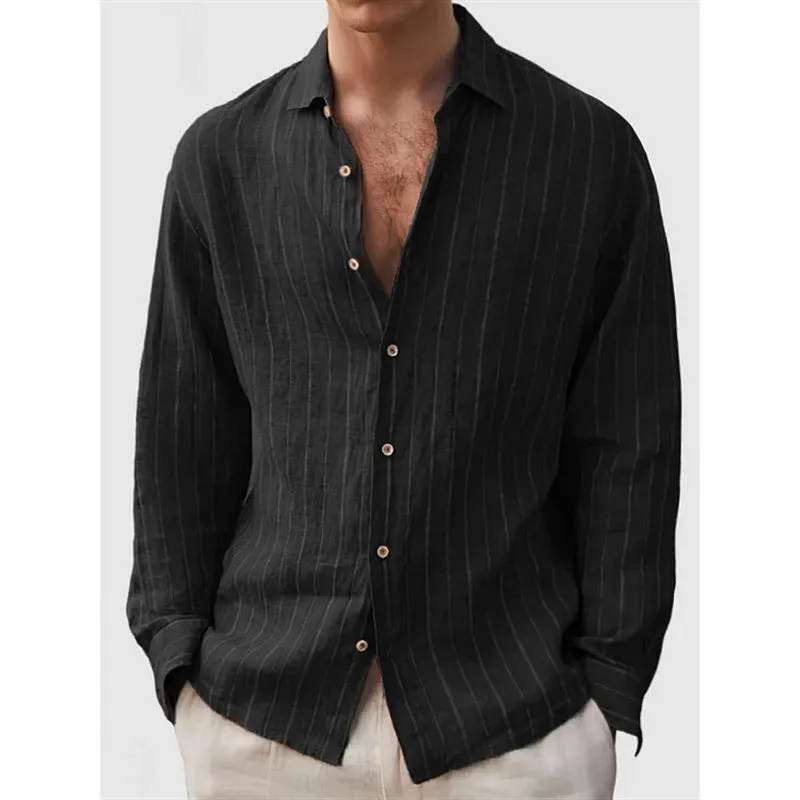 Man wearing a loose-fit, striped, short-sleeve cardigan shirt in a casual setting.