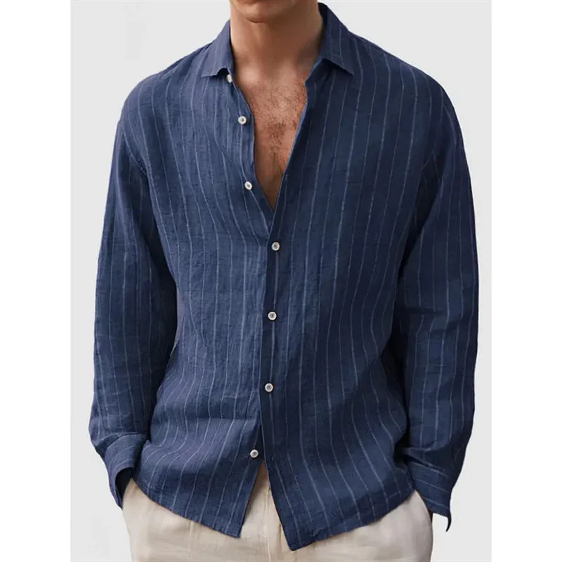 Man wearing a loose-fit, striped, short-sleeve cardigan shirt in a casual setting.