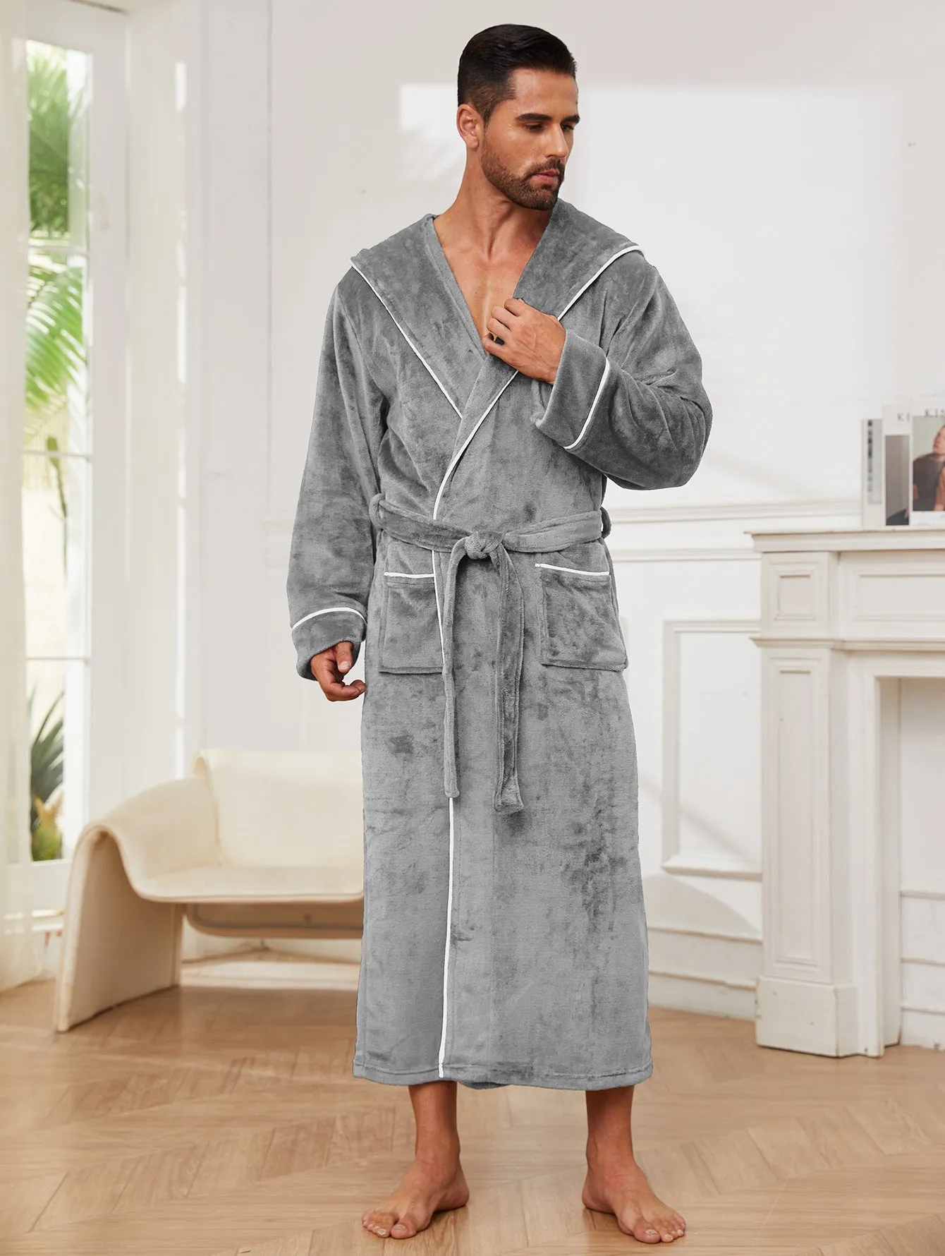 Man wearing a light grey flannel bathrobe in a European style for winter.