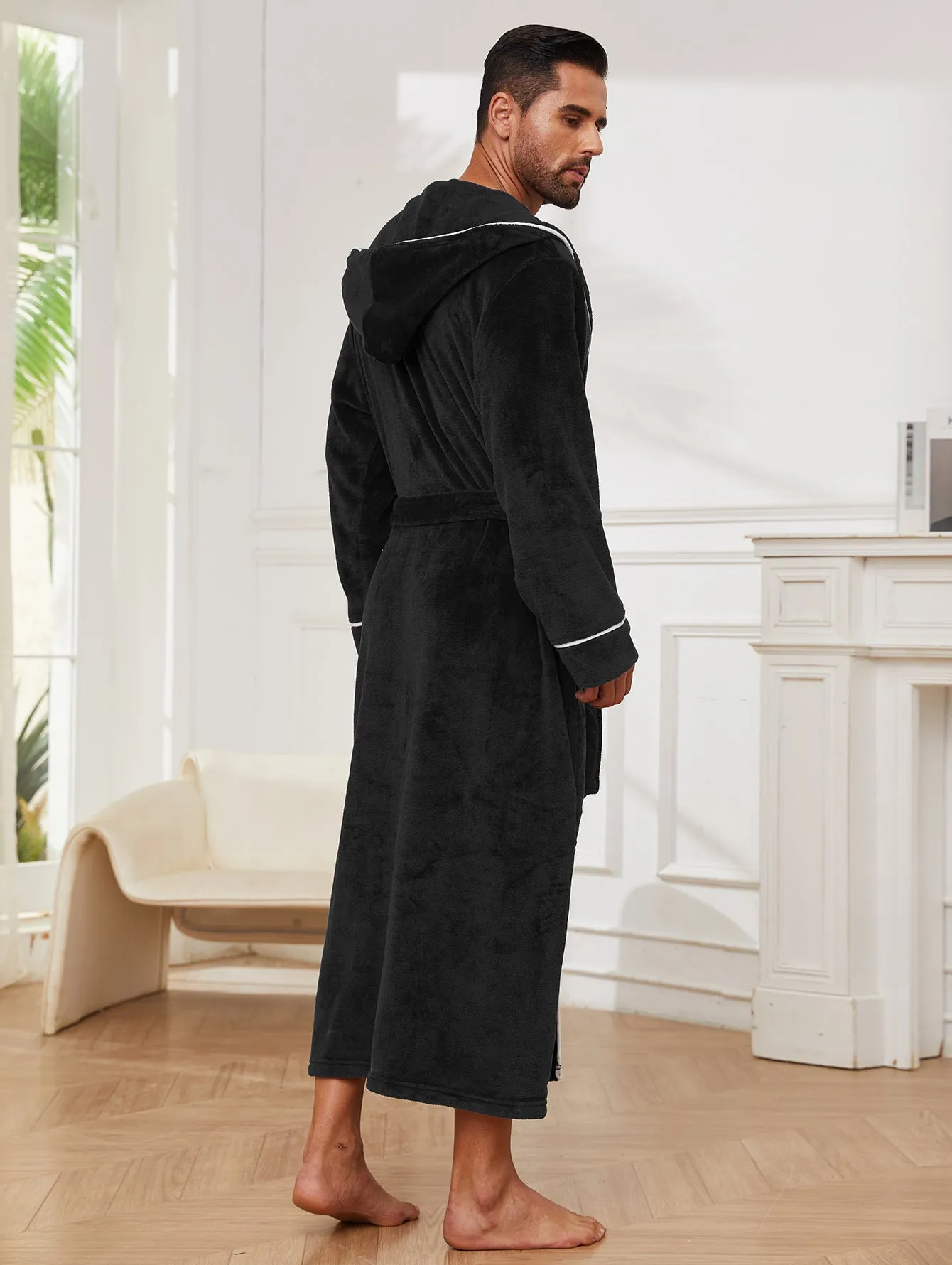 Man wearing a light grey flannel bathrobe in a European style for winter.