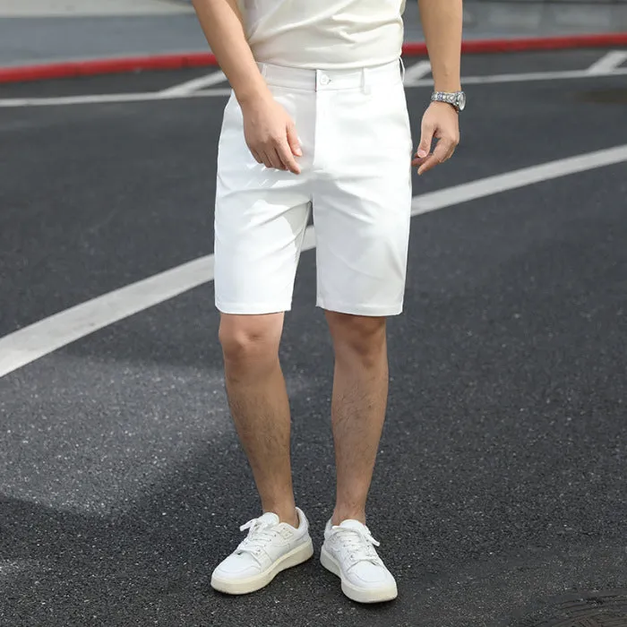 Man wearing loose-fit beige mid-length casual trousers with an elasticated waistband.