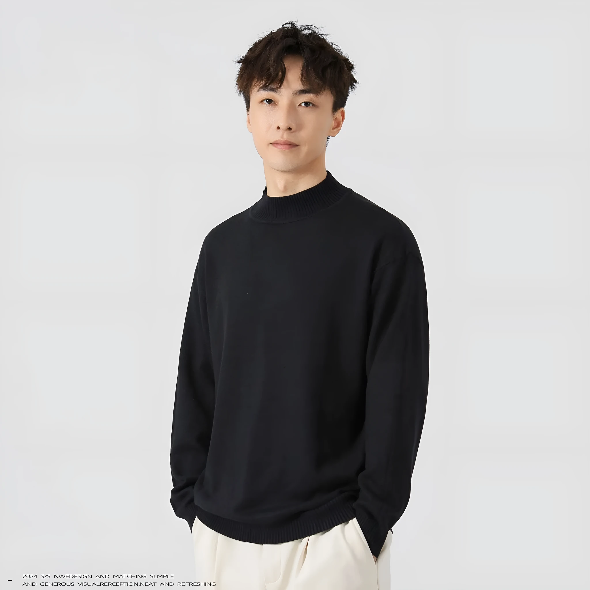 A man's loose-fitting, long-sleeve pullover sweater in a solid colour, showing a casual relaxed fit.