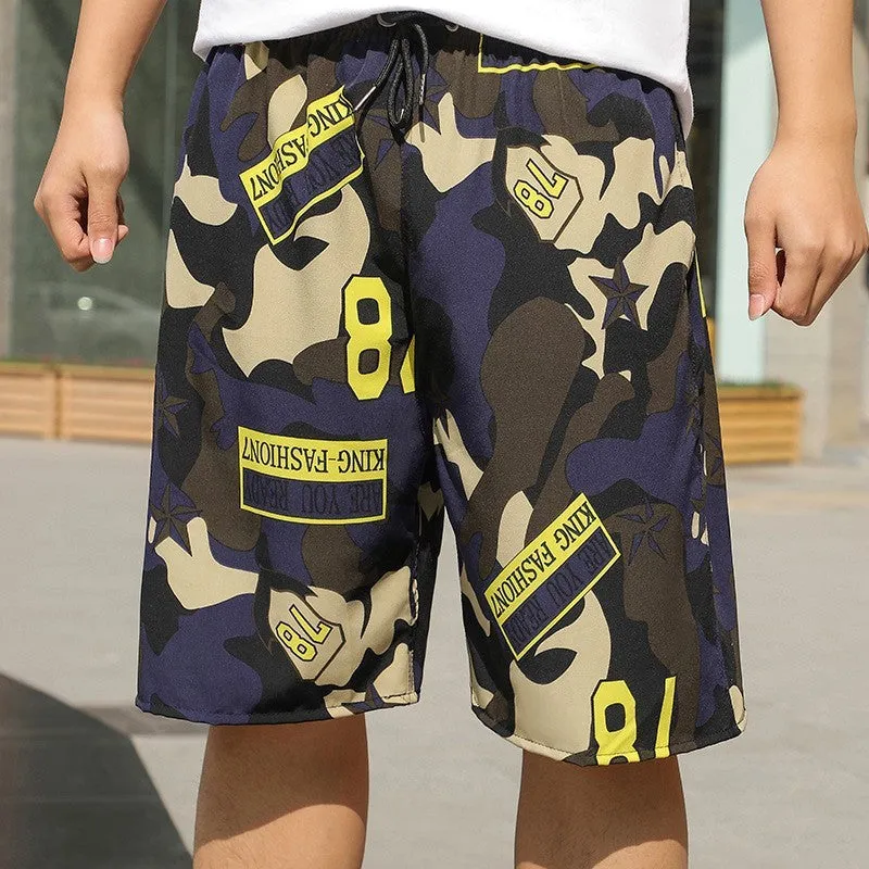 Man wearing loose striped ice silk beach trousers on sand