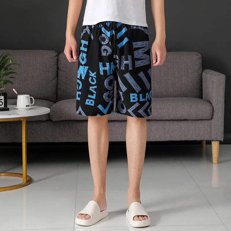 Man wearing loose striped ice silk beach trousers on sand