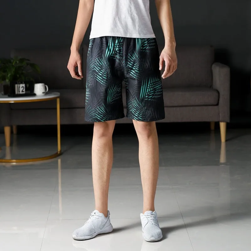 Man wearing loose striped ice silk beach trousers on sand