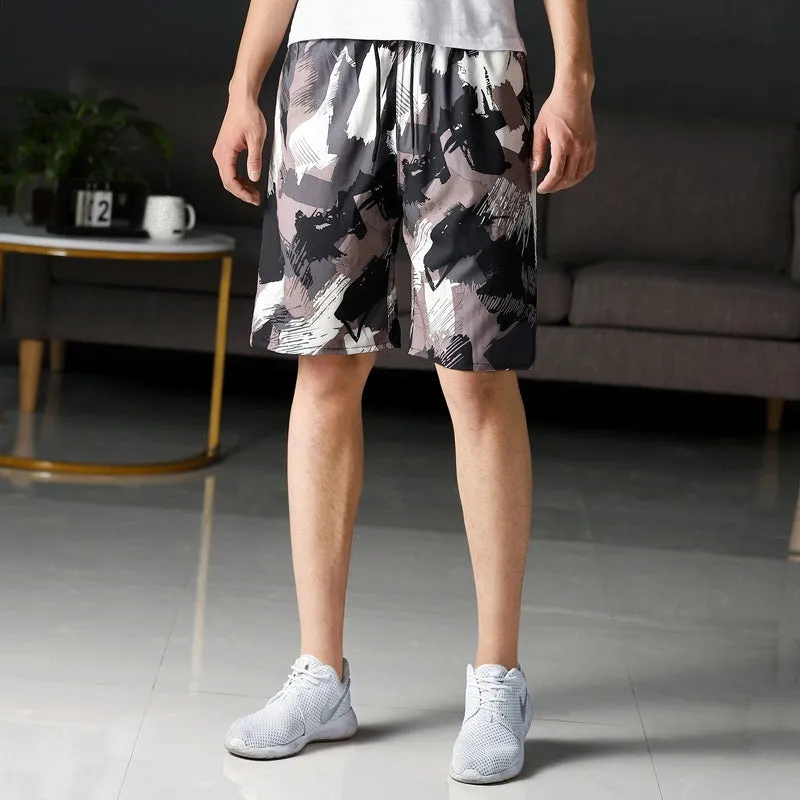 Man wearing loose striped ice silk beach trousers on sand