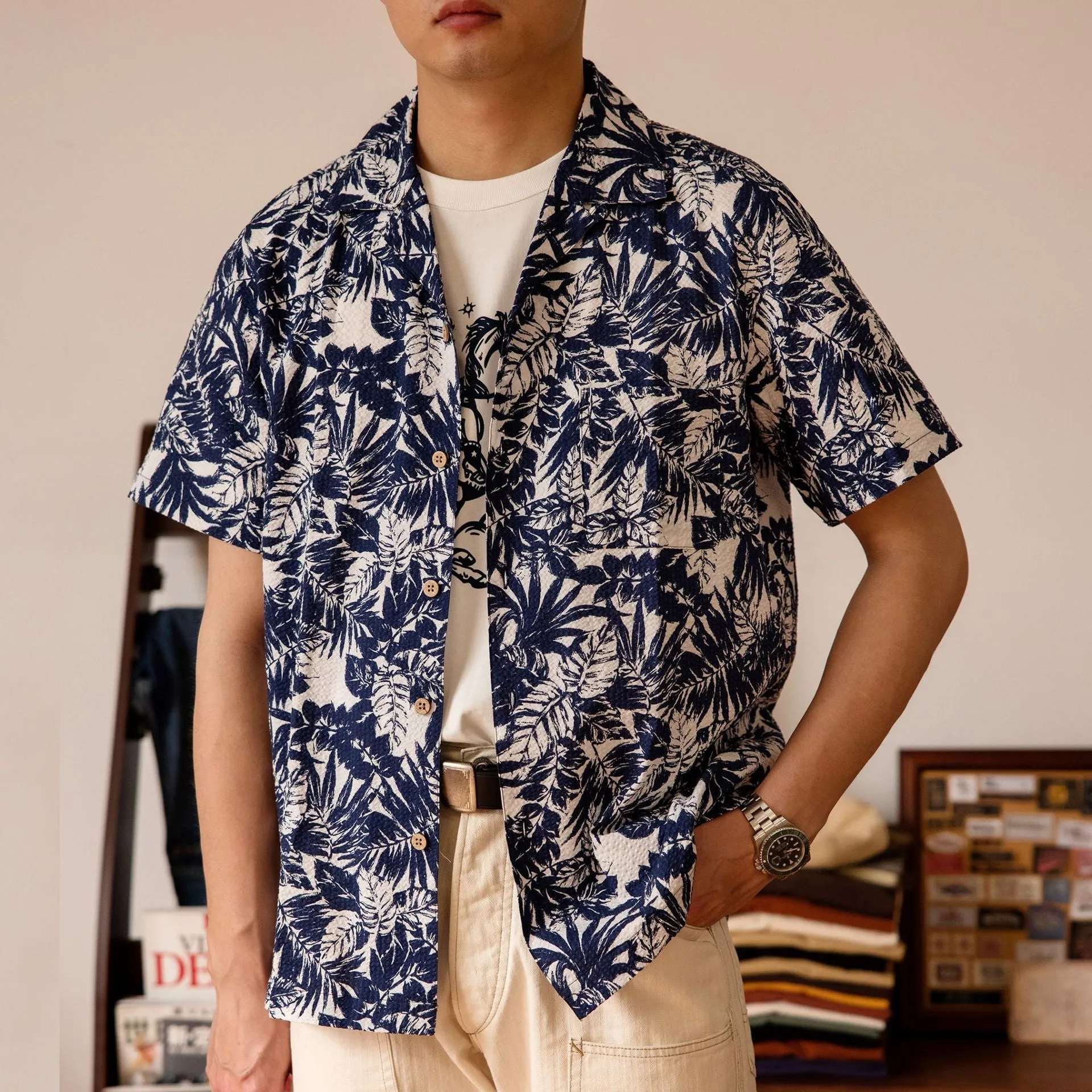 Vintage floral print seersucker shirt with a Cuban collar on a mannequin, showing loose cardigan fit.