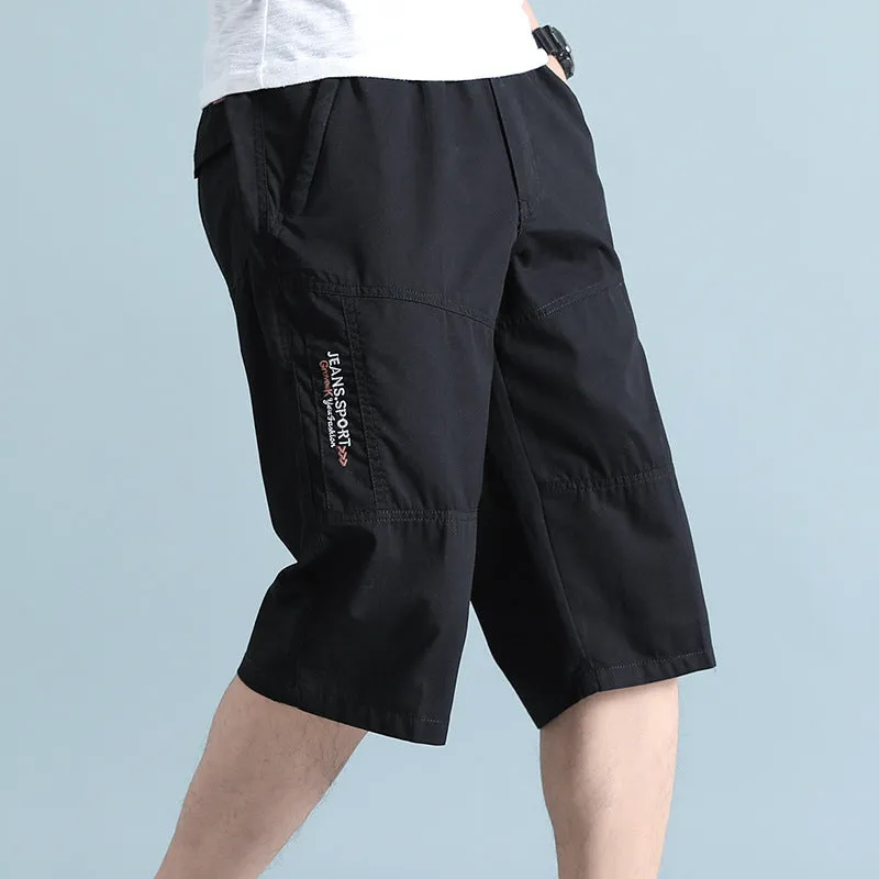 Men's light grey cotton sports pants with straight cut and cropped length on hanger