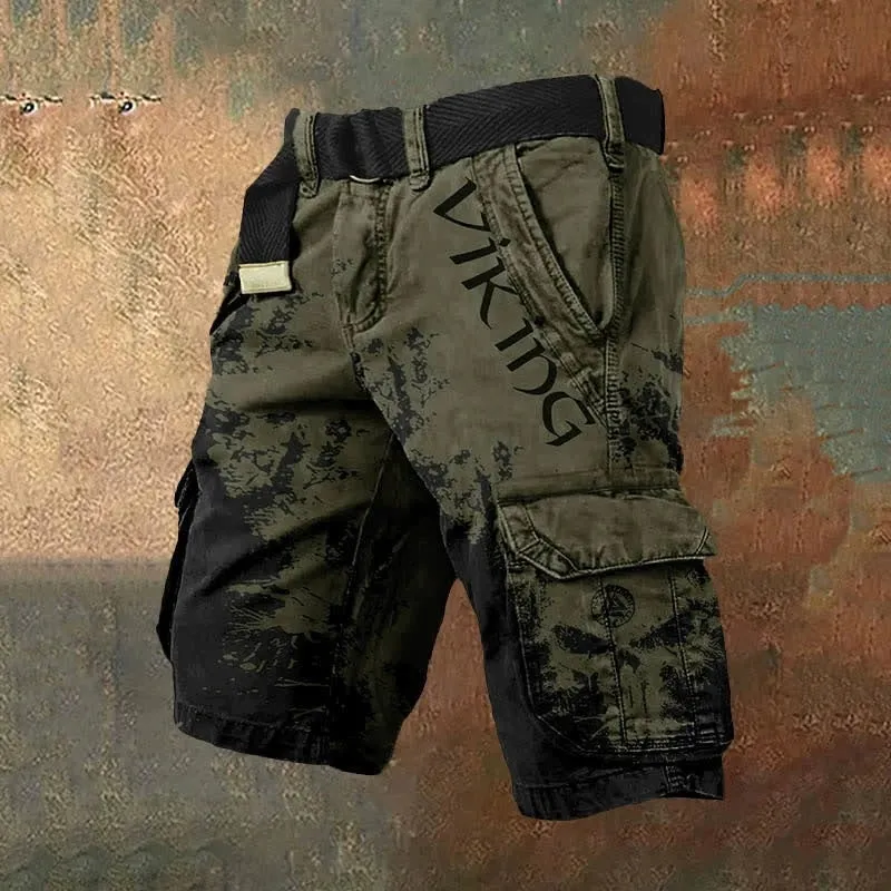 Man wearing grey shorts with a graphic 3D print and a full-length zip fastening.