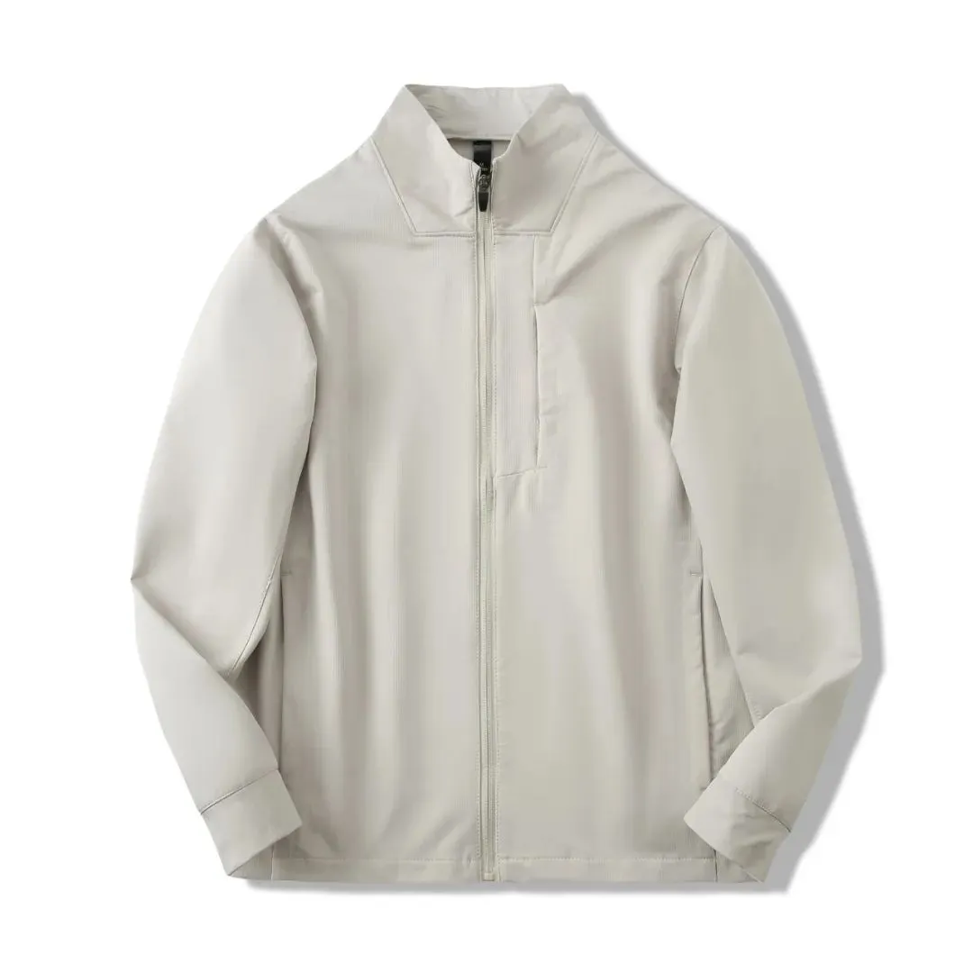 Man wearing a beige stand collar polyester casual jacket with long sleeves and a straight hem.