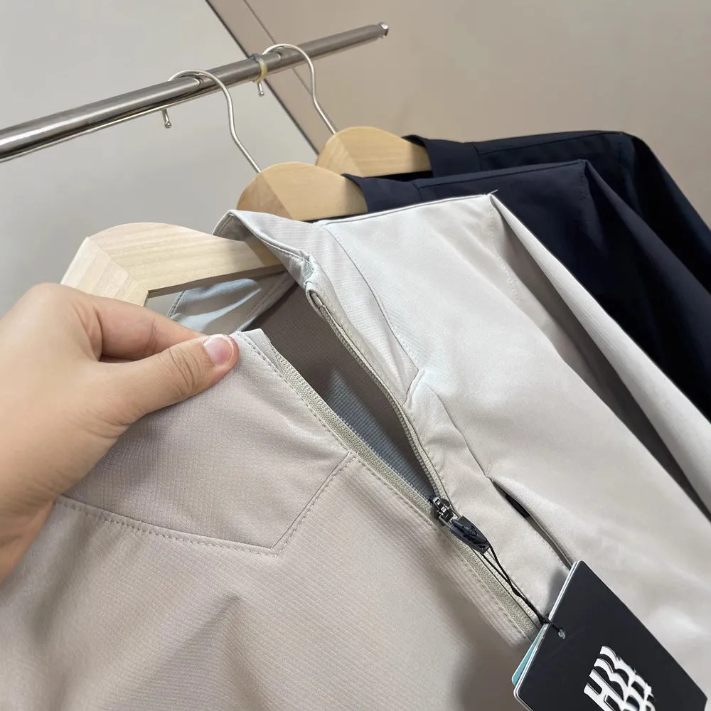 Man wearing a beige stand collar polyester casual jacket with long sleeves and a straight hem.