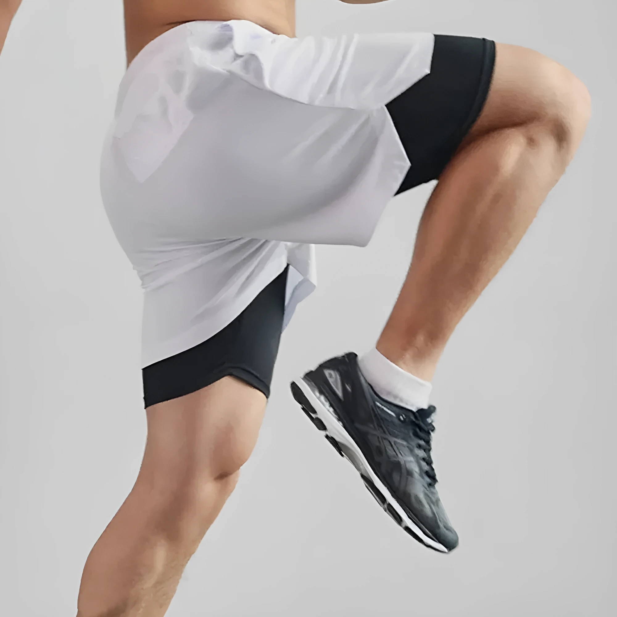 Men's camouflage pattern double-layer sports shorts in quick-dry fabric on a plain background.