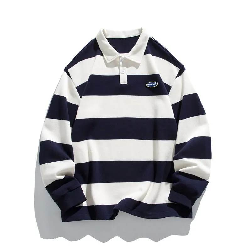 Man modelling a loose-fit, striped, long-sleeve polo shirt with a lapel collar in sapphire blue.