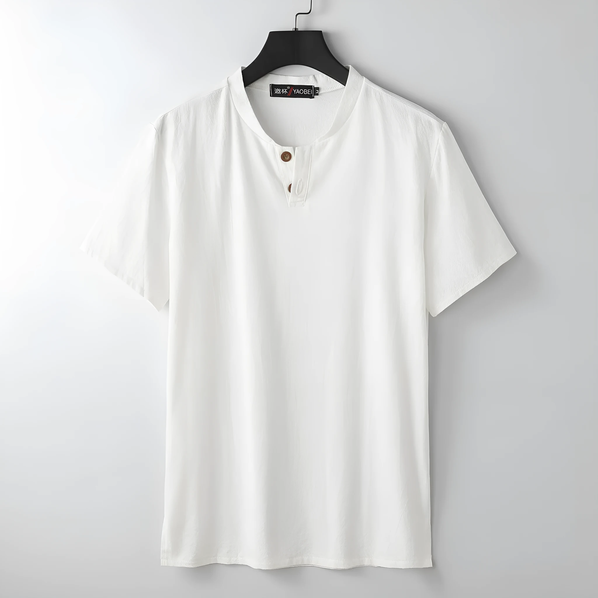 Women's loose-fit apricot coloured V-neck short sleeve cotton top on a hanger.