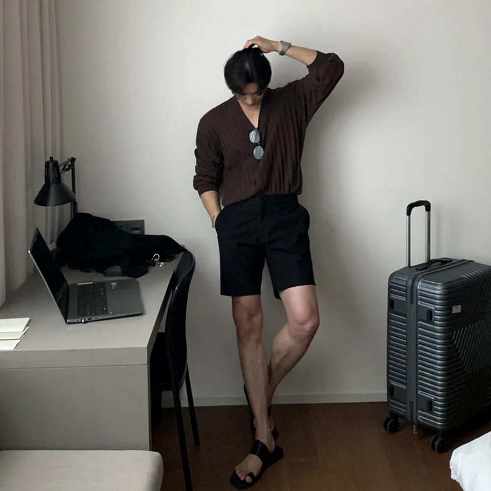 Men's straight-leg casual shorts in solid black, shown laid flat, featuring a non-iron polyester fabric.