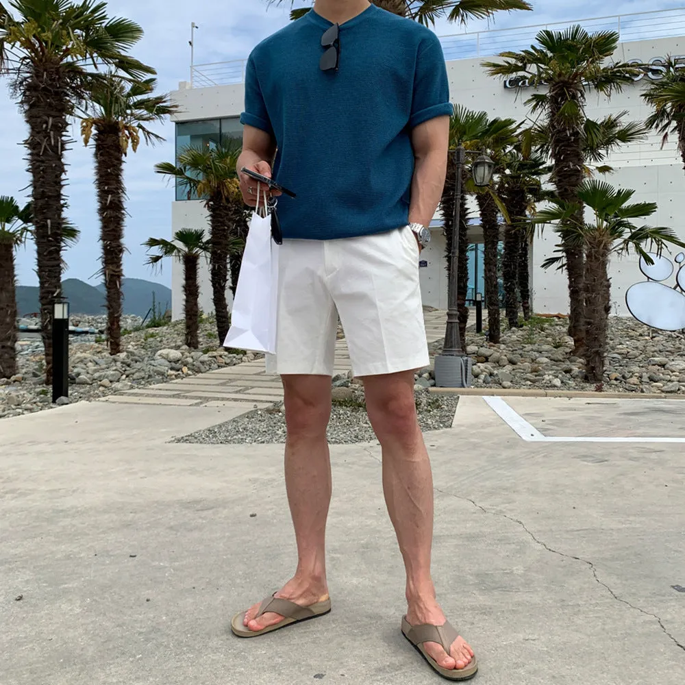 Men's straight-leg casual shorts in solid black, shown laid flat, featuring a non-iron polyester fabric.