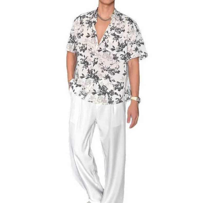 Loose black and white floral print short sleeve casual shirt for women on a hanger