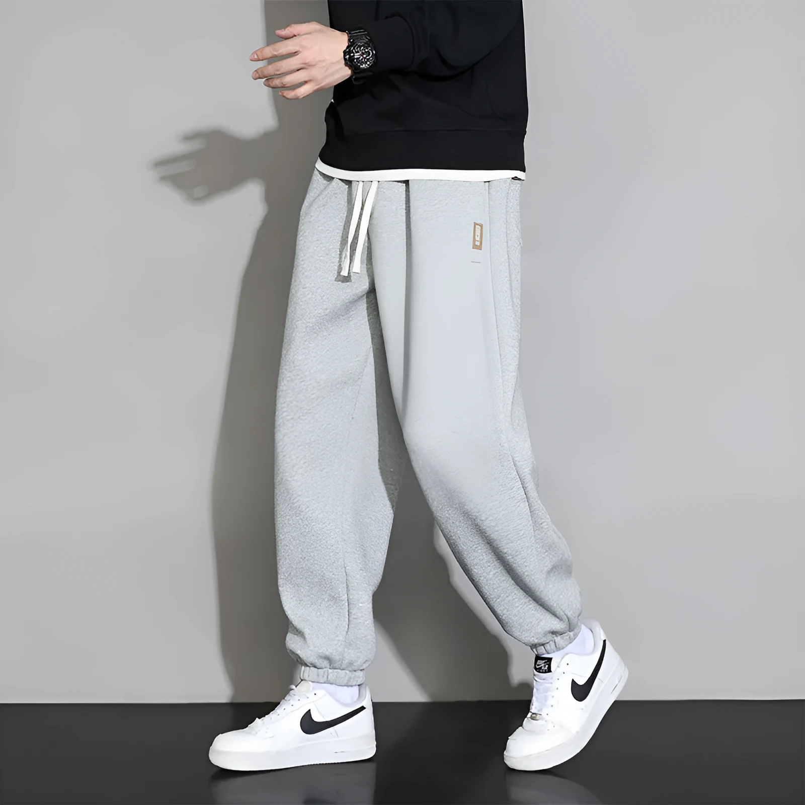 Men's loose grey sports trousers with drawstring waist in cotton-polyester blend