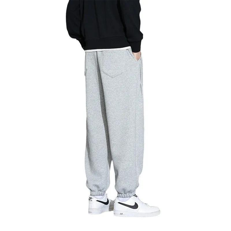 Men's loose grey sports trousers with drawstring waist in cotton-polyester blend
