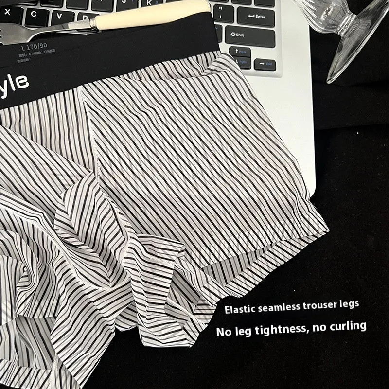 Men's ice silk boxer briefs in black showing seamless design and transparent crotch panel.