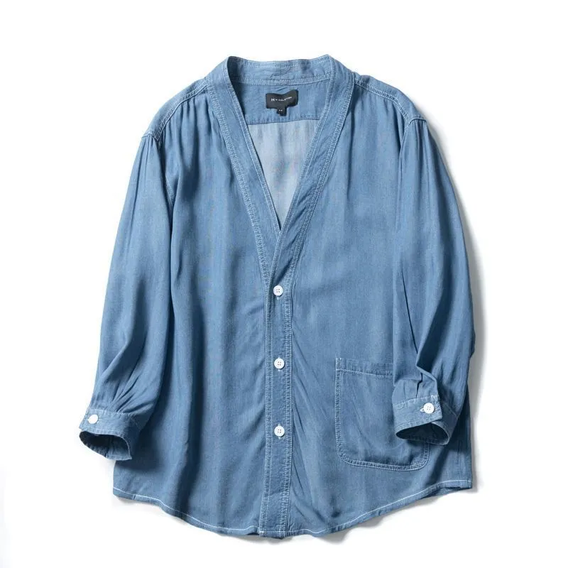 Men's dark blue casual denim coat with three-quarter sleeves and a V-neck collar.