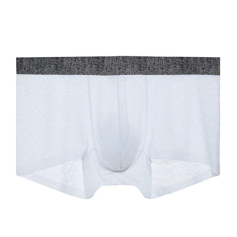 Man wearing seamless lace boxer briefs in a solid colour with low-waist design.