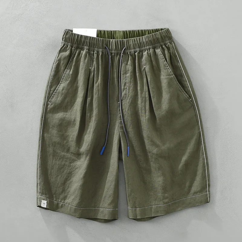 Men's loose straight leg linen shorts in green with drawstring waist and mid thigh length