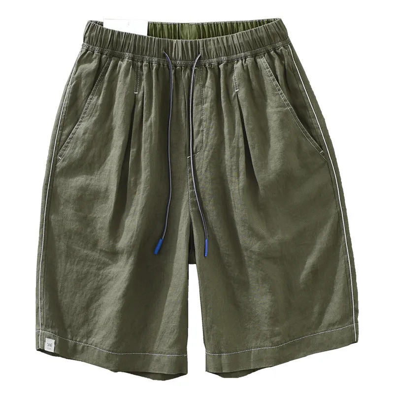 Men's loose straight leg linen shorts in green with drawstring waist and mid thigh length