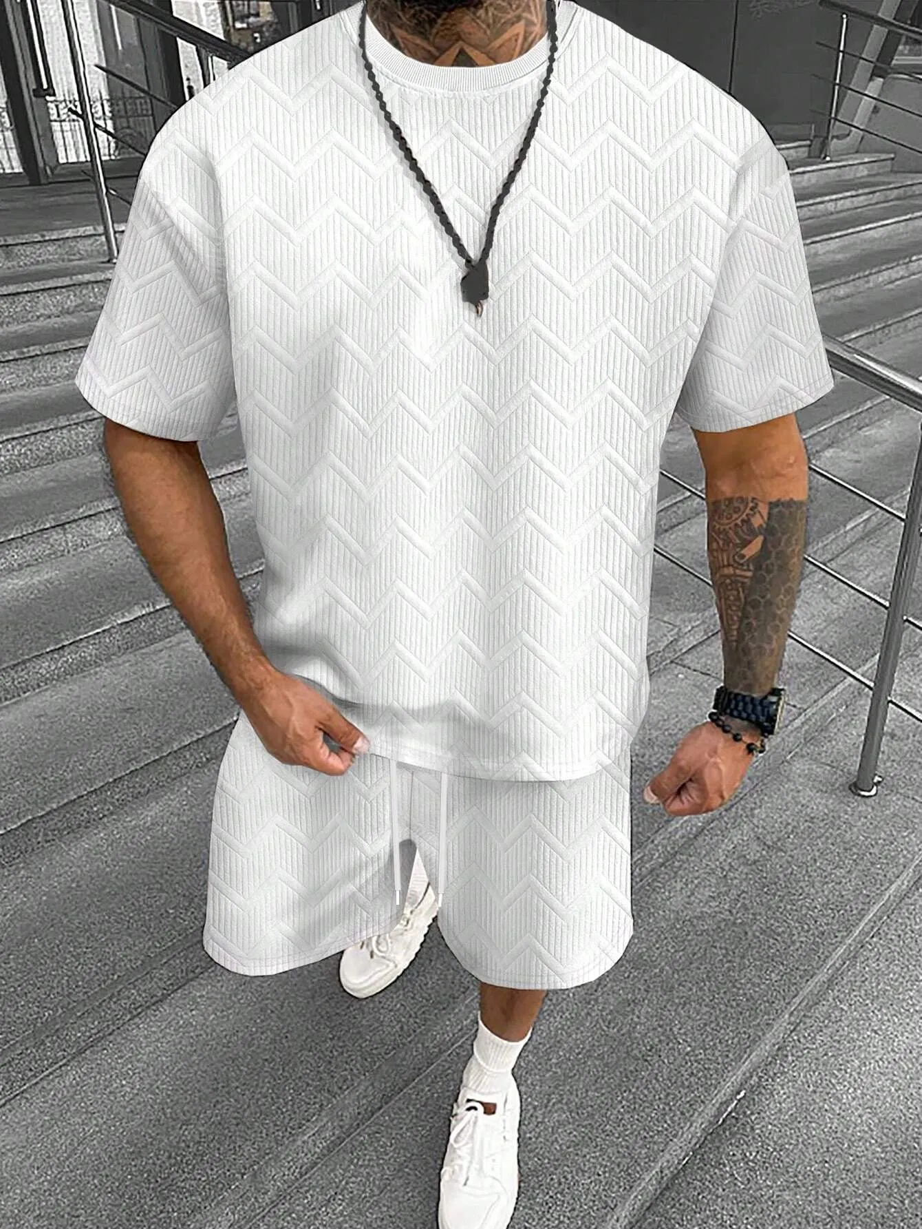 Men's grey short sleeve top and matching shorts suit set for casual leisure wear.