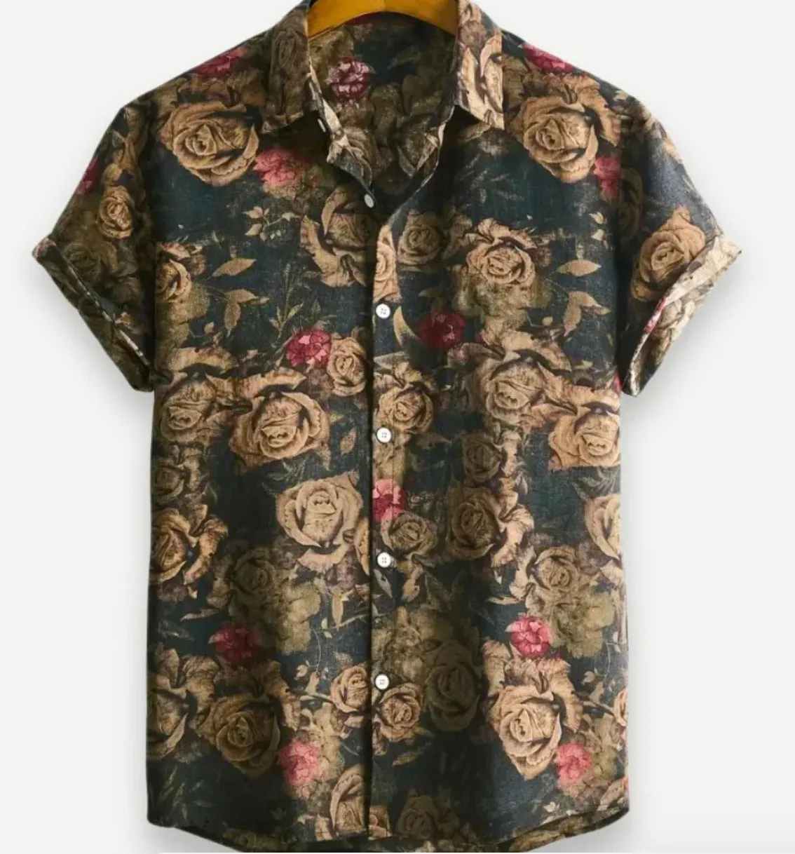 Man's short sleeve Hawaiian print shirt with lapel collar and floral pattern, shown in a casual setting.