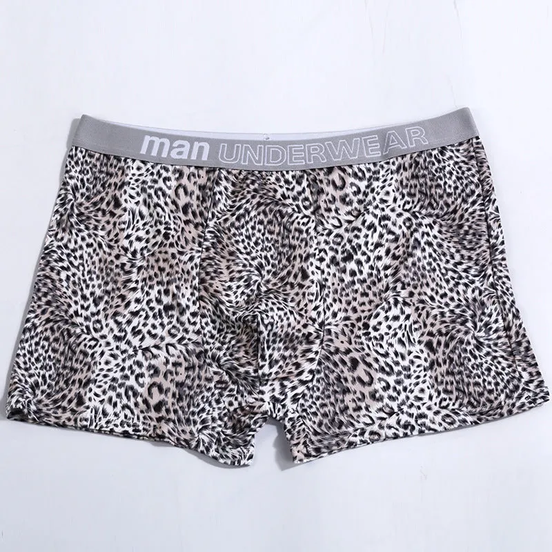 Men's loose fit leopard print underwear in milk silk polyester fabric showing mid-waist design