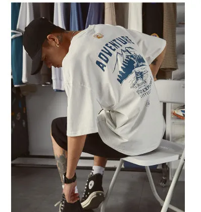 Men's black loose fit short-sleeved t-shirt on a hanger