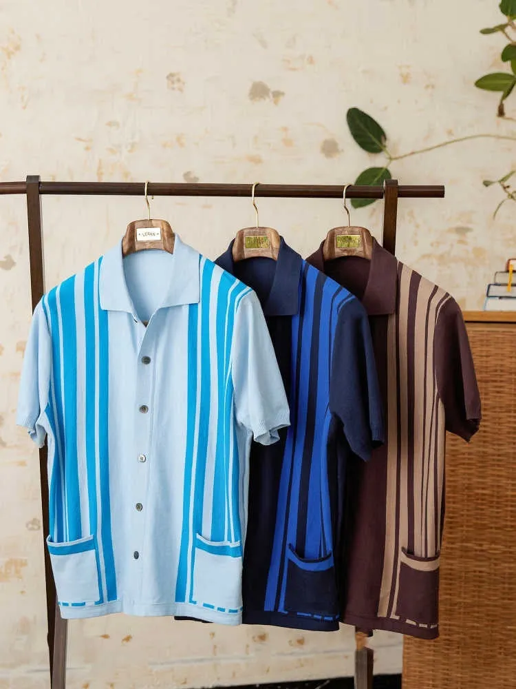 Man's short-sleeved striped polo cardigan with a lapel collar in a light blue colour.