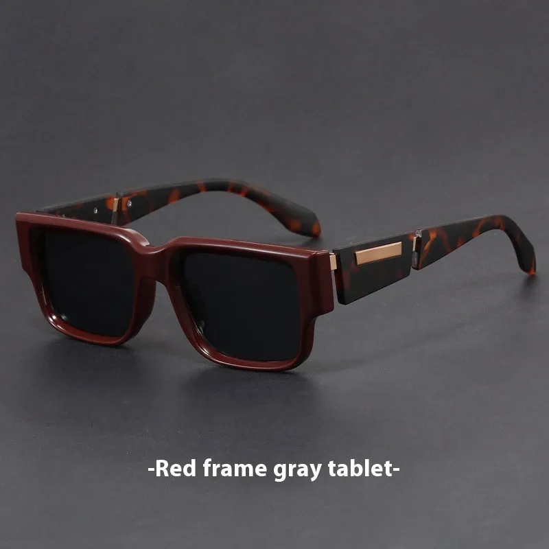 Retro square thick frame sunglasses with blue frame and gray blue lenses.