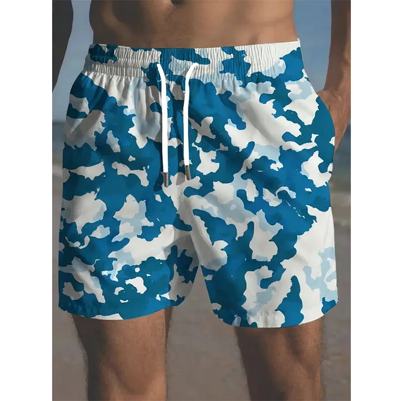 Men's printed polyester beach shorts on a model, showing elastic waistband and casual fit.