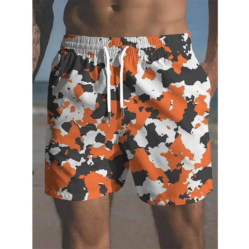 Men's printed polyester beach shorts on a model, showing elastic waistband and casual fit.