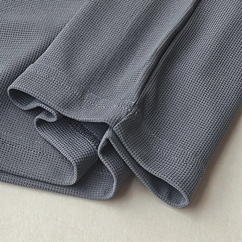 Men's dark grey heavy waffle texture short sleeve t-shirt on a hanger