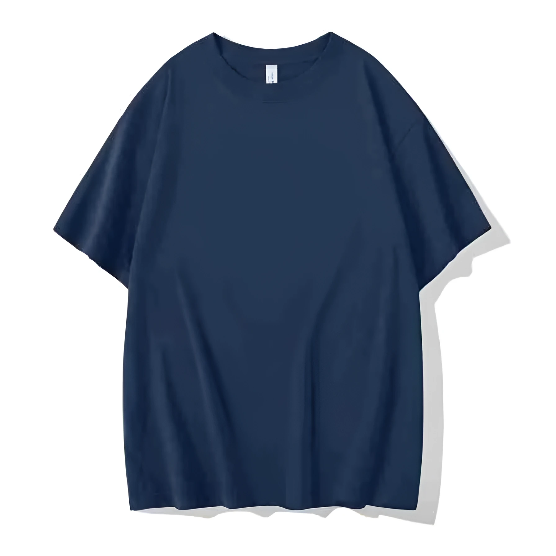 Man wearing a heavyweight dark grey drop shoulder T-shirt with layered shoulder detail.