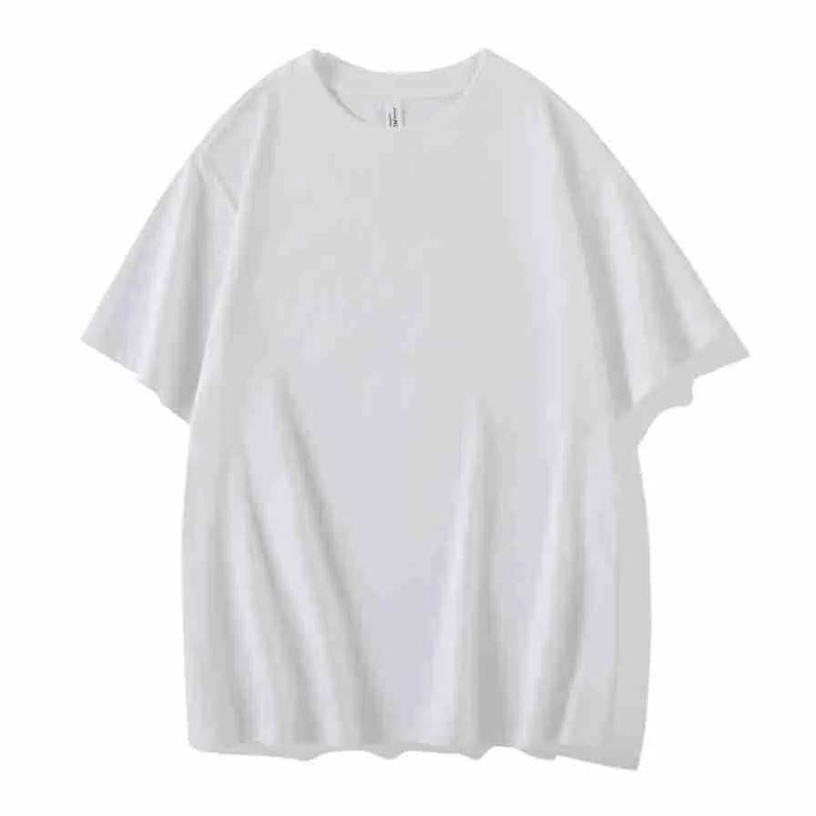 Man wearing a heavyweight dark grey drop shoulder T-shirt with layered shoulder detail.