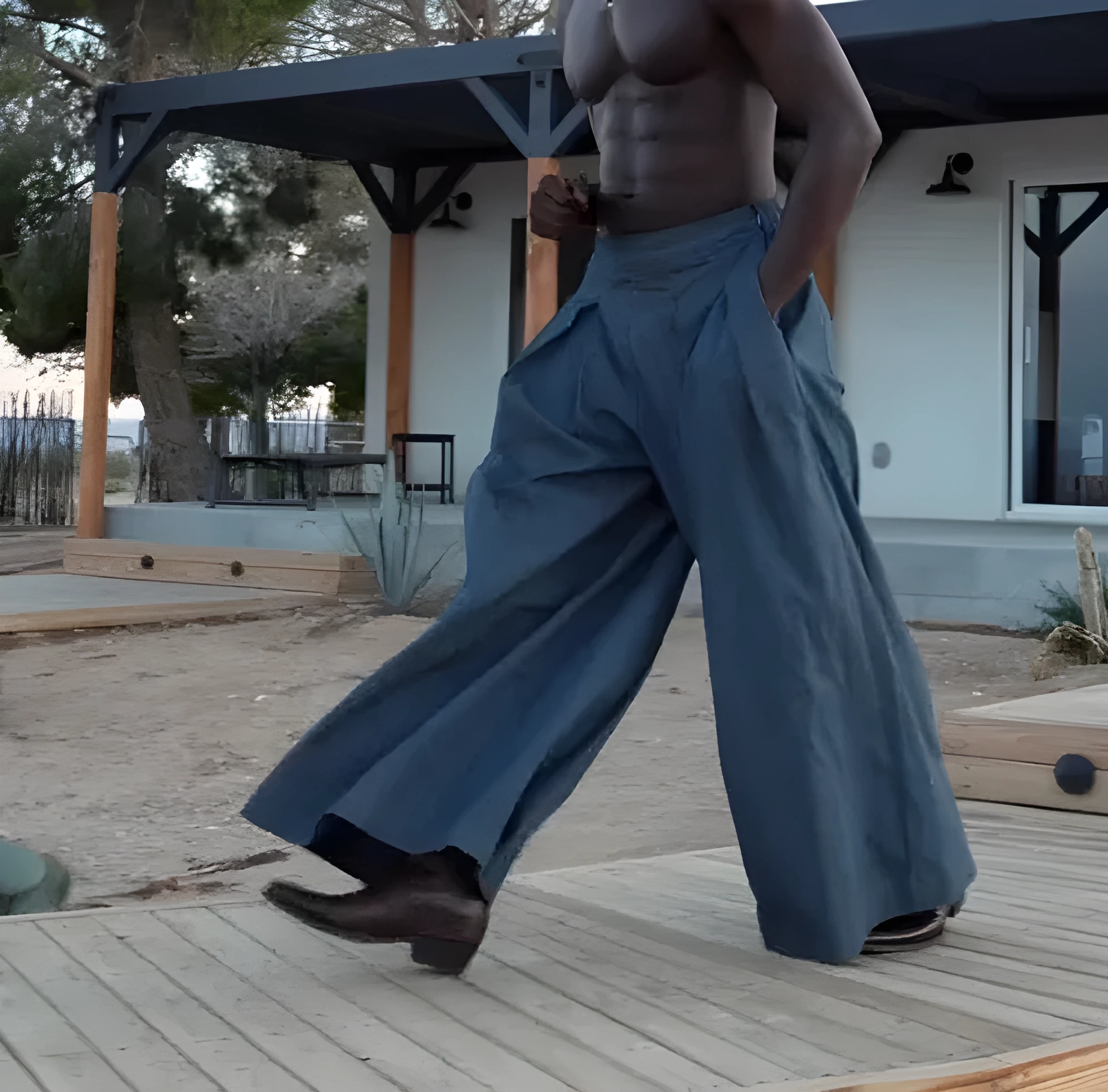 Men's grey trousers with waist pleats, wide-leg cut, and elasticated waistband shown in size range S to 2XL