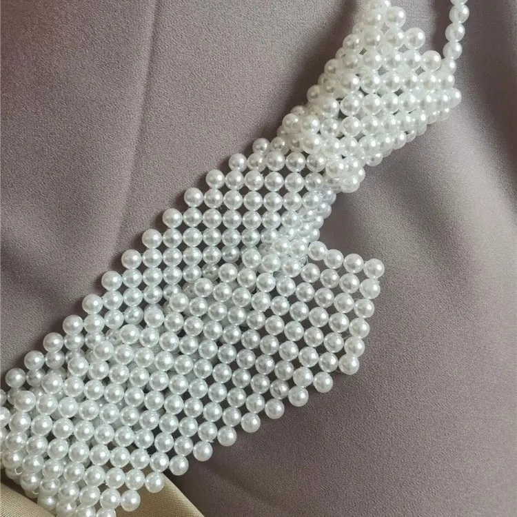 Women's pearl tie body chain with hollow out design and adjustable alloy closure in black or white colour