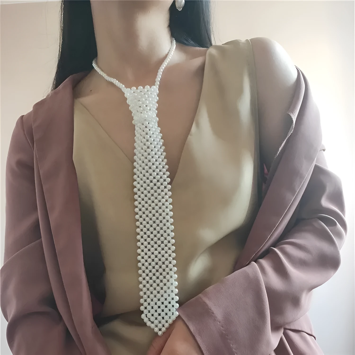 Women's pearl tie body chain with hollow out design and adjustable alloy closure in black or white colour