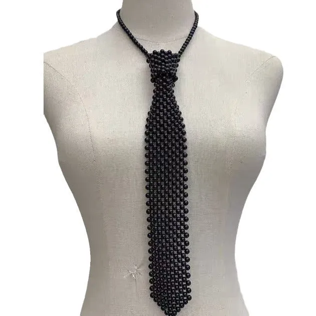 Women's pearl tie body chain with hollow out design and adjustable alloy closure in black or white colour