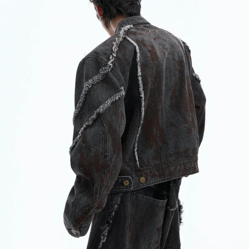 Black distressed denim coat and pants set with padded shoulders and gradient dye pattern