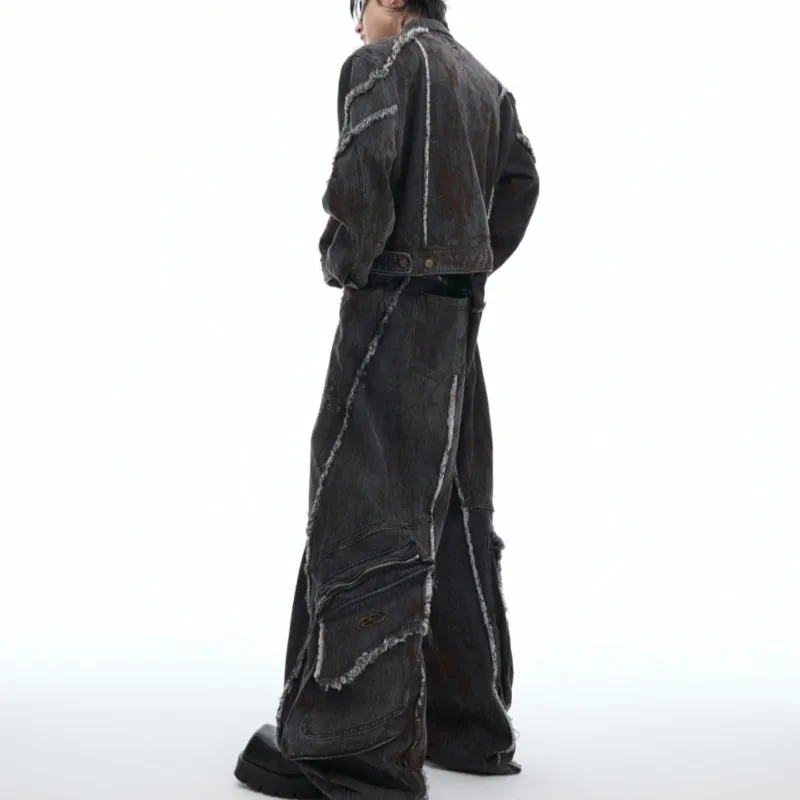 Black distressed denim coat and pants set with padded shoulders and gradient dye pattern